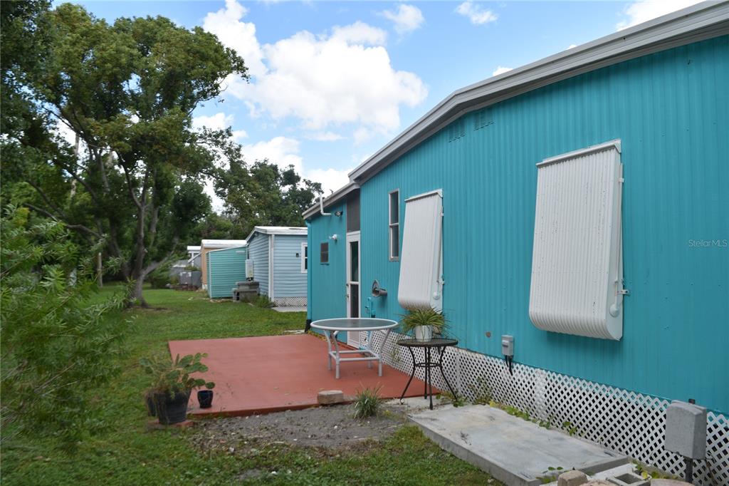 4407 Tucker Square New Port Richey, FL 34652 - Photo 17 of 69 a view of backyard of house with outdoor seating