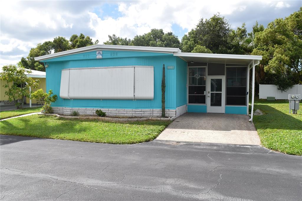 4407 Tucker Square New Port Richey, FL 34652 - Photo 2 of 69 a front view of a house with garden