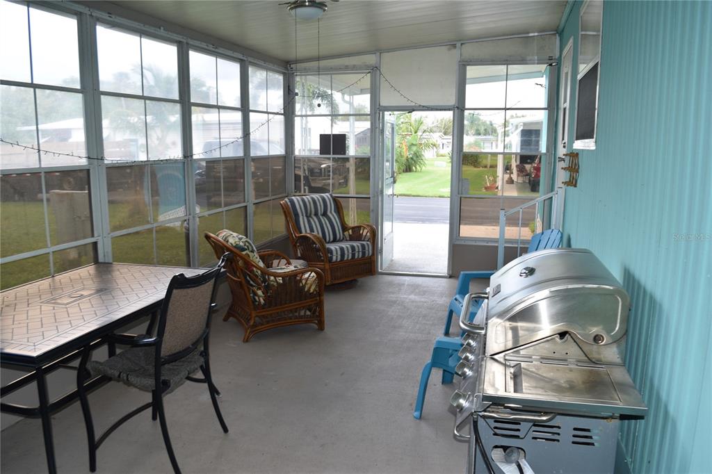 4407 Tucker Square New Port Richey, FL 34652 - Photo 24 of 69 a living room with furniture and a floor to ceiling window