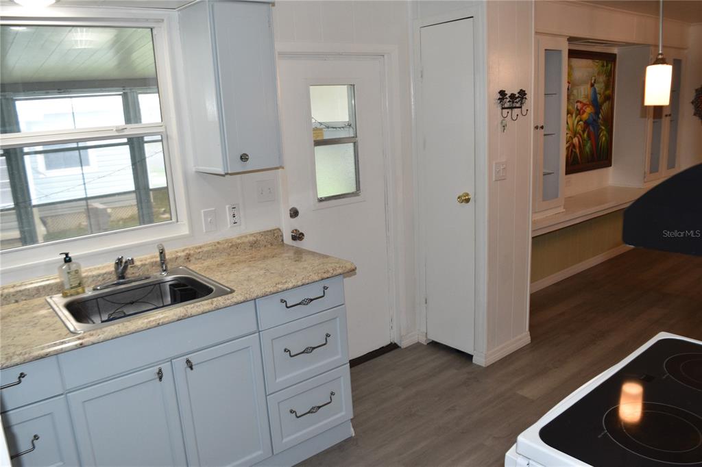 4407 Tucker Square New Port Richey, FL 34652 - Photo 29 of 69 a kitchen with a sink and cabinets