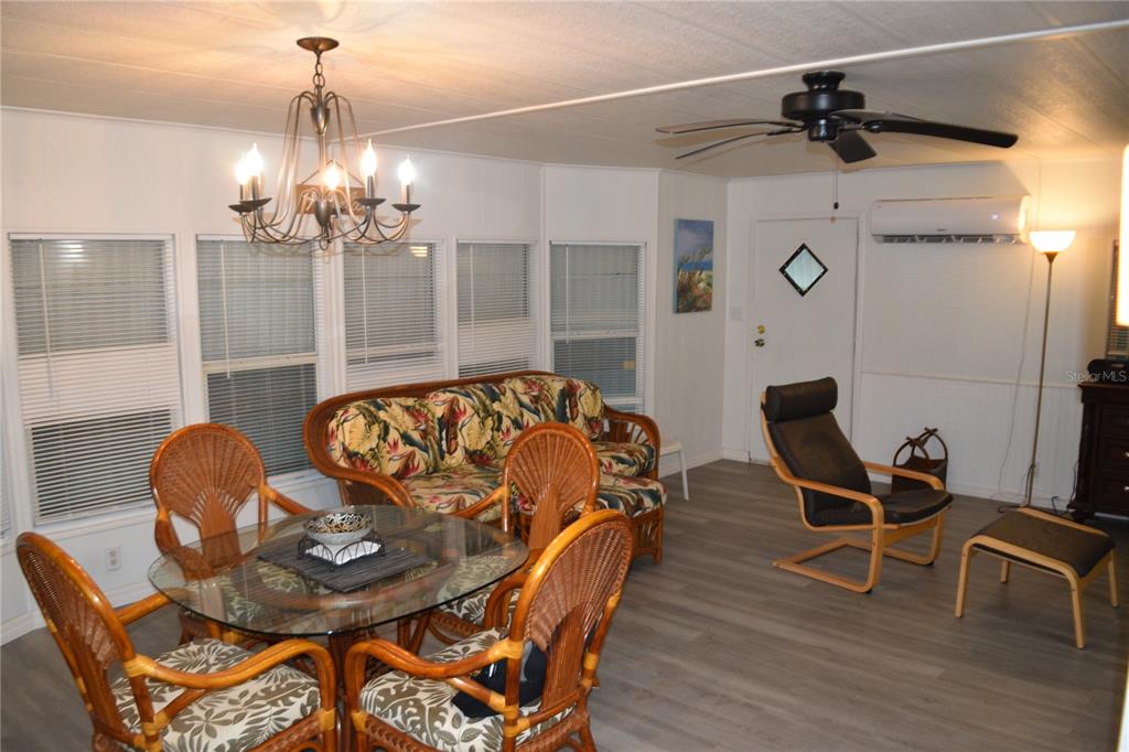 4407 Tucker Square New Port Richey, FL 34652 - Photo 30 of 69 a living room with furniture and a chandelier