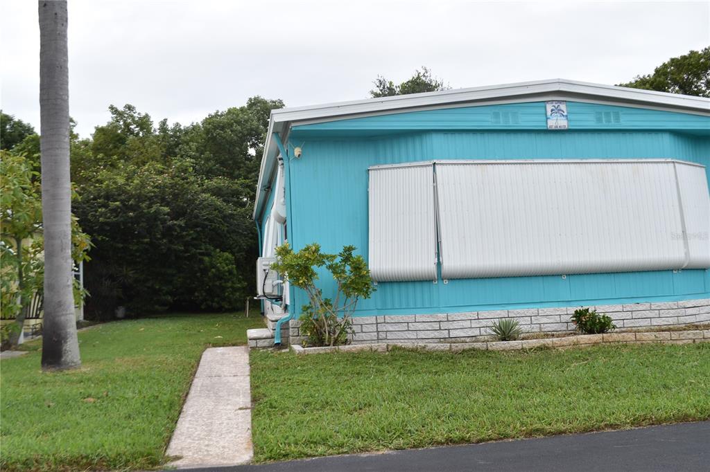 4407 Tucker Square New Port Richey, FL 34652 - Photo 3 of 69 a backyard of a house with lots of green space