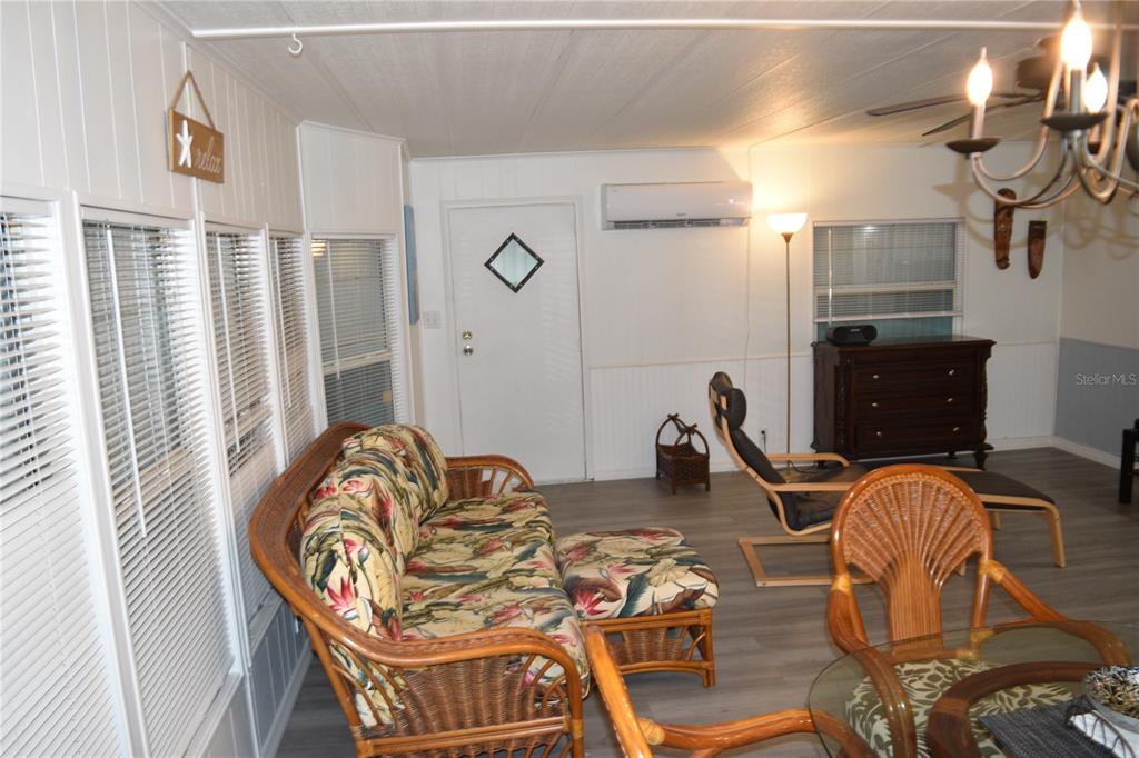 4407 Tucker Square New Port Richey, FL 34652 - Photo 31 of 69 a living room with furniture a rug and a window