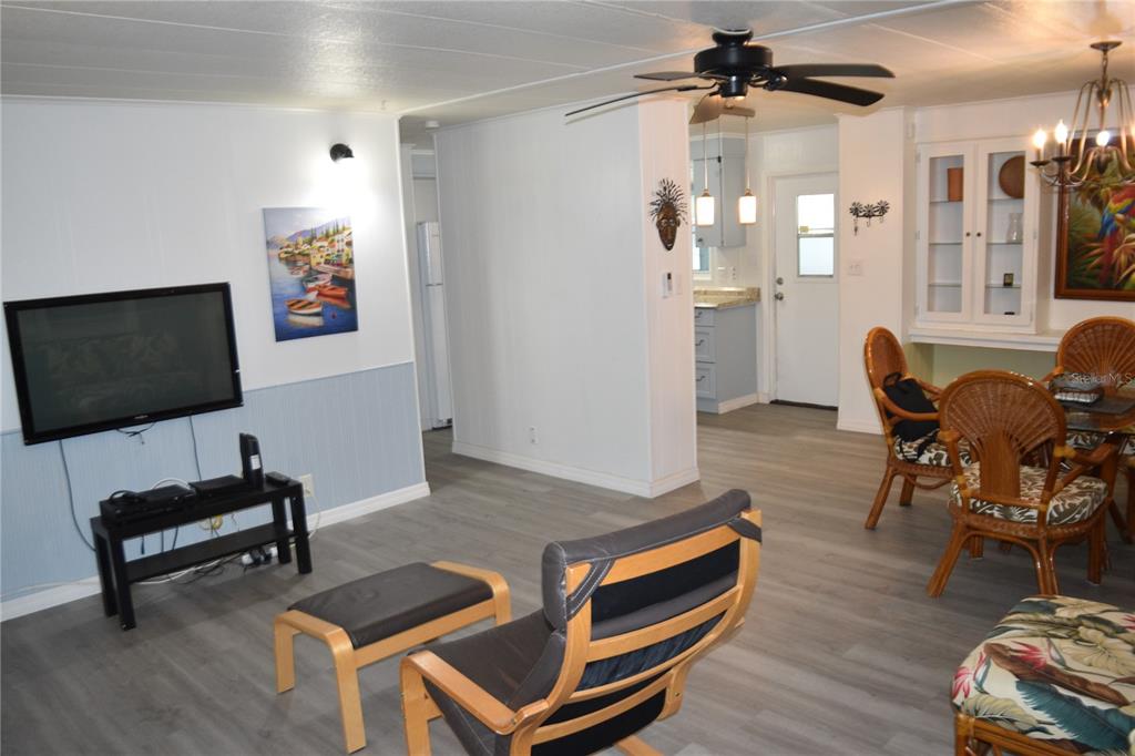 4407 Tucker Square New Port Richey, FL 34652 - Photo 35 of 69 a living room with furniture a rug and a flat screen tv