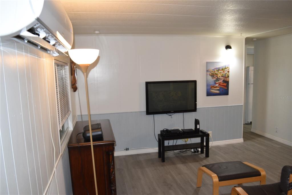 4407 Tucker Square New Port Richey, FL 34652 - Photo 36 of 69 a living room with furniture and a flat screen tv