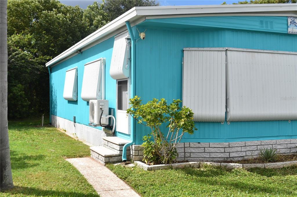 4407 Tucker Square New Port Richey, FL 34652 - Photo 4 of 69 a front view of a house with a yard