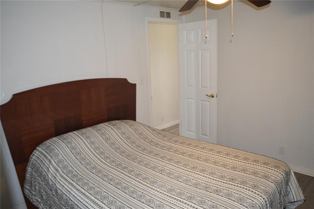 4407 Tucker Square New Port Richey, FL 34652 - Photo 44 of 69 a bedroom with a bed and a dresser