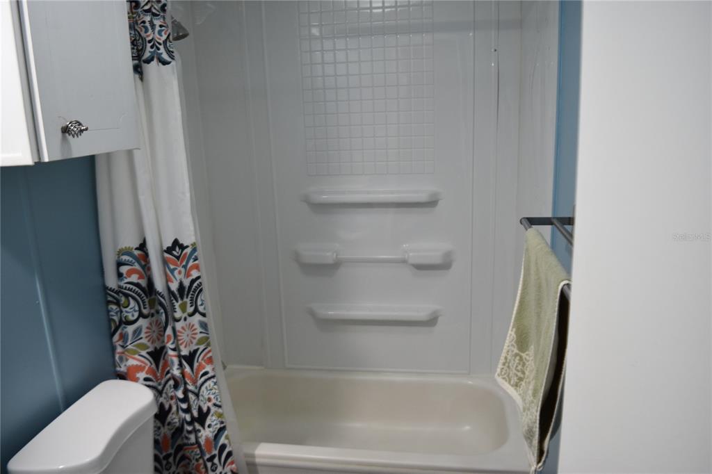 4407 Tucker Square New Port Richey, FL 34652 - Photo 47 of 69 a bathroom with a bathtub and a toilet