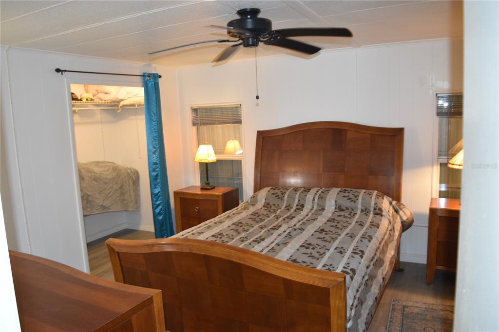 4407 Tucker Square New Port Richey, FL 34652 - Photo 49 of 69 a bed sitting in a bedroom next to a window