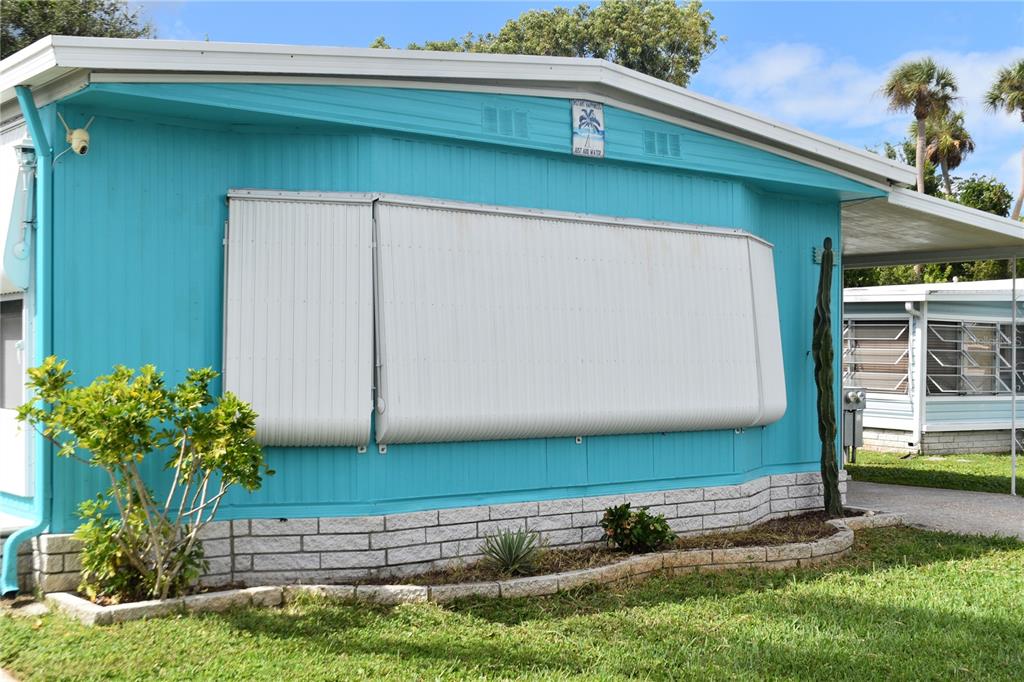 4407 Tucker Square New Port Richey, FL 34652 - Photo 5 of 69 a front view of a house with garden