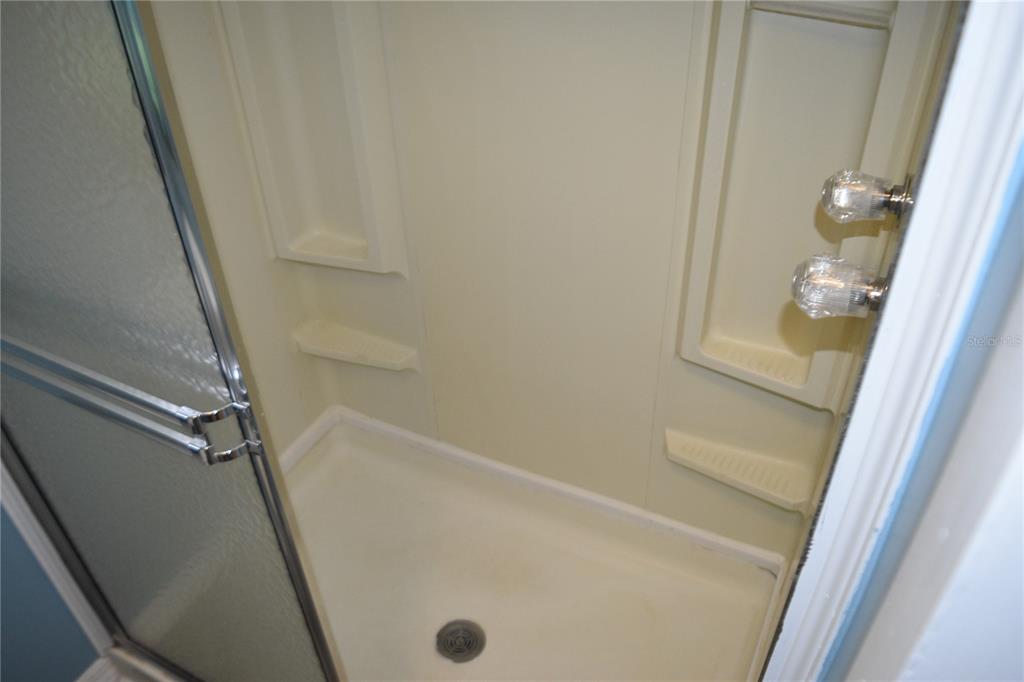 4407 Tucker Square New Port Richey, FL 34652 - Photo 61 of 69 a bathroom with a tub and a shower