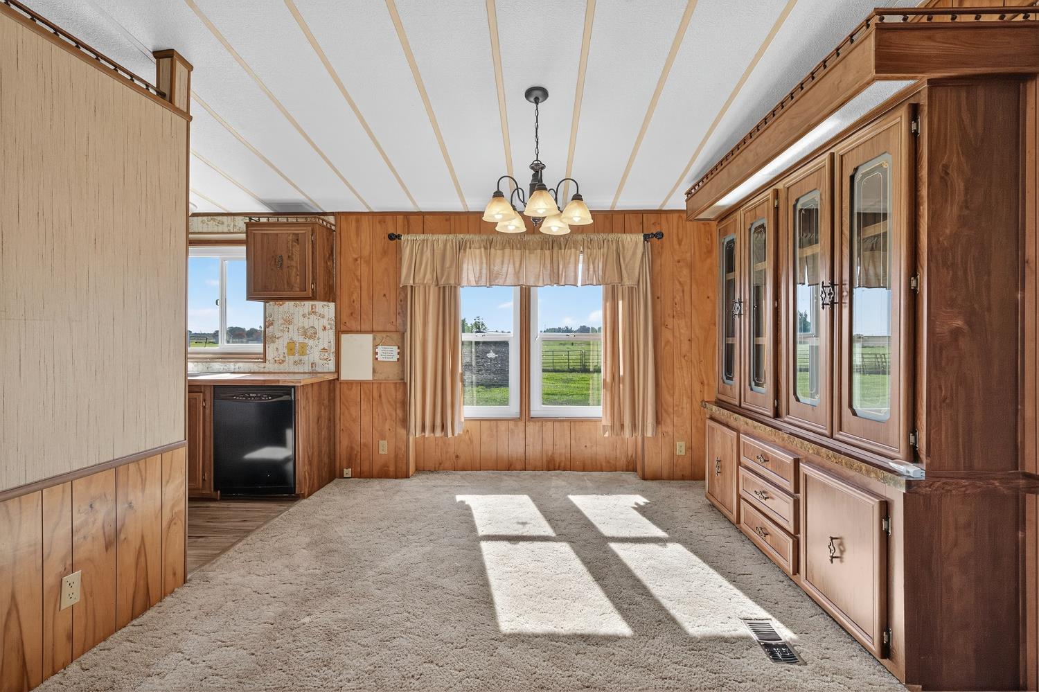 11900 Brandt Road Lockeford, CA 95237 - Photo 15 of 49 a view of a kitchen with a sink and dishwasher a refrigerator with wooden floor