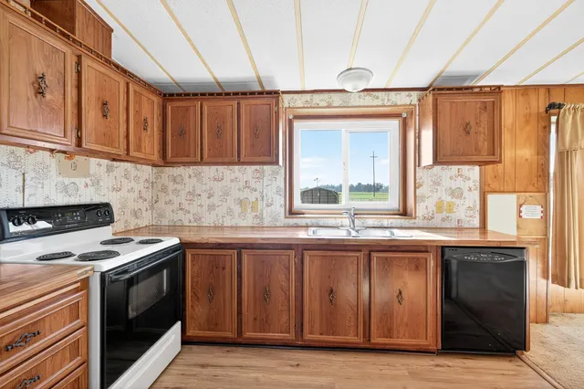 a white refrigerator freezer sitting inside of a kitchen