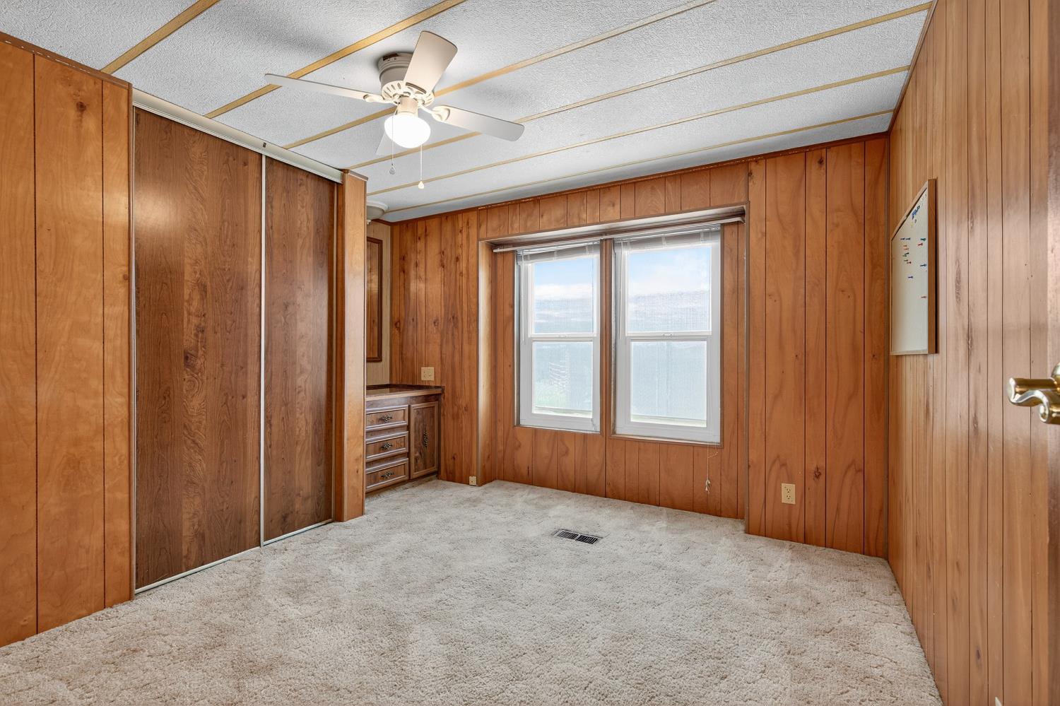 11900 Brandt Road Lockeford, CA 95237 - Photo 28 of 49 wooden floor in an empty room with a window
