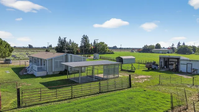 a view of a house with a back yard