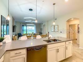 707 Ocean Course Avenue Davenport, FL 33896 - Photo 11 of 31 a kitchen with counter top space and appliances