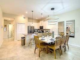 707 Ocean Course Avenue Davenport, FL 33896 - Photo 17 of 31 a view of a dining room with furniture
