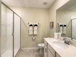 707 Ocean Course Avenue Davenport, FL 33896 - Photo 25 of 31 a bathroom with a sink toilet and shower