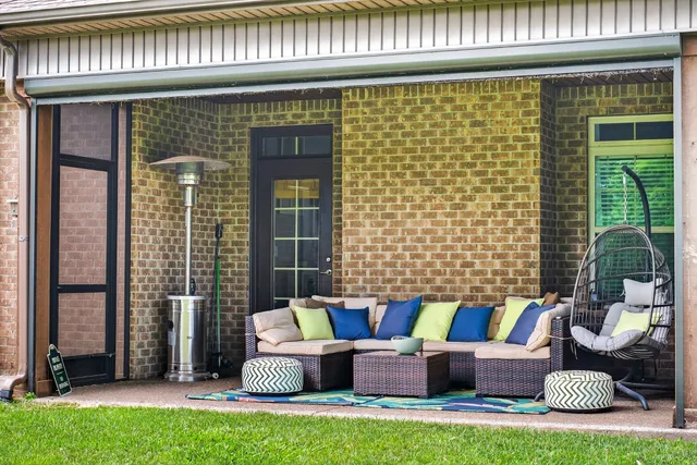a outdoor living space with furniture and a potted plant