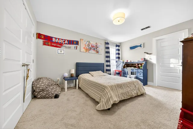 a bedroom with a bed and a cabinets