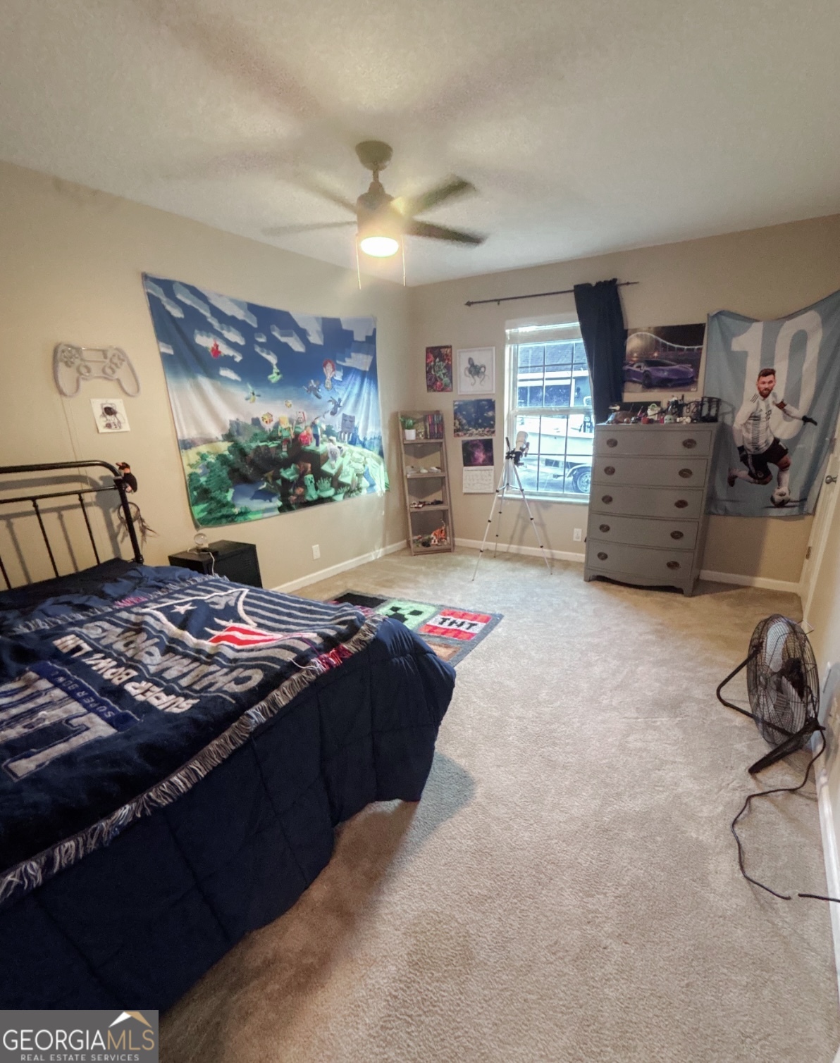 102 Honeysuckle Road Kingsland, GA 31548 - Photo 12 of 17 a bed sitting in a room next to a window