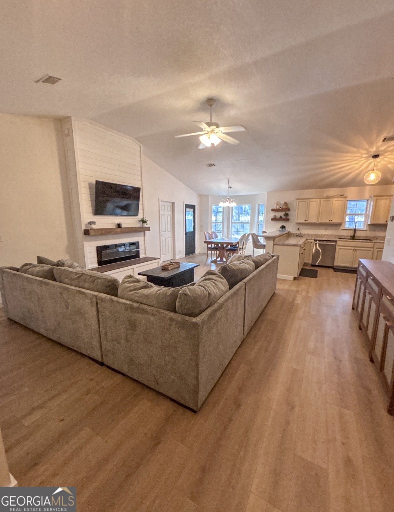 102 Honeysuckle Road Kingsland, GA 31548 - Photo 2 of 17 a living room with furniture and a flat screen tv