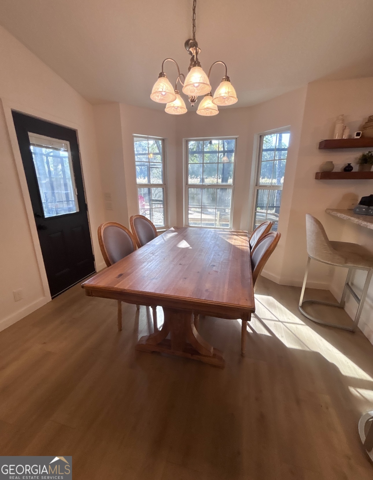 102 Honeysuckle Road Kingsland, GA 31548 - Photo 4 of 17 a view of a dining room with furniture and wooden floor