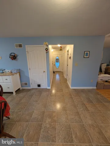 a view of a storage & utility room with a window
