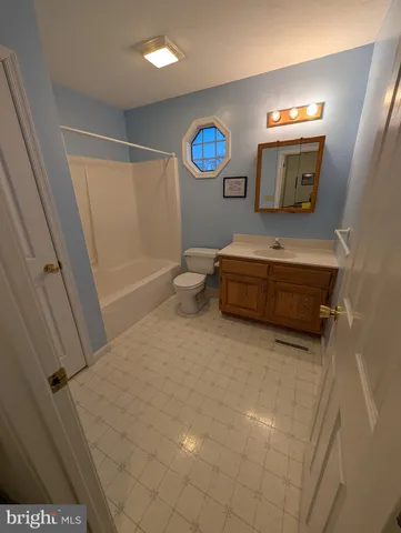 a bathroom with a sink a mirror and a toilet