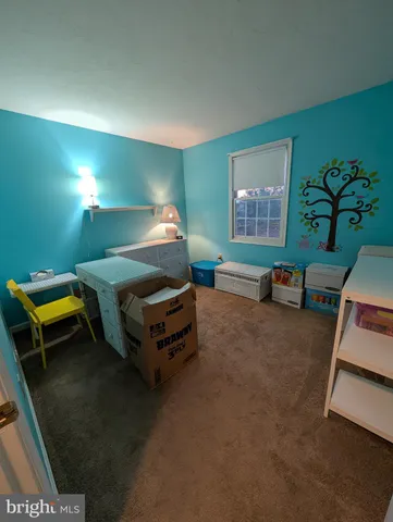 a room with furniture and a lamp