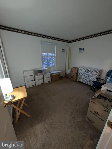 a reading room with furniture and a air conditioner vent