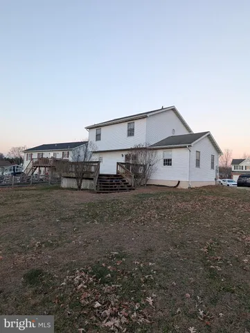 a view of a house with a back yard