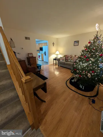 a living room with furniture and flowers