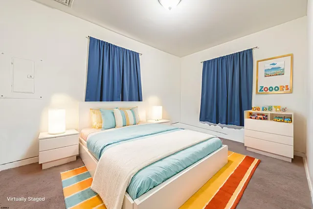 a bedroom with a bed and a cabinets