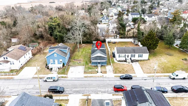 an aerial view of residential houses with outdoor space