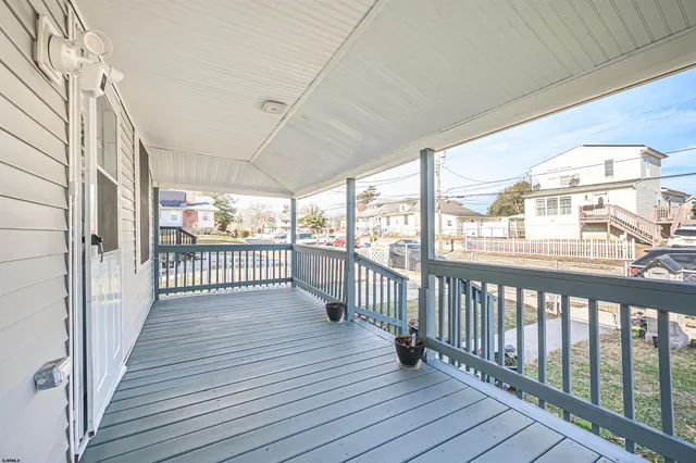 a view of a balcony with wooden floor