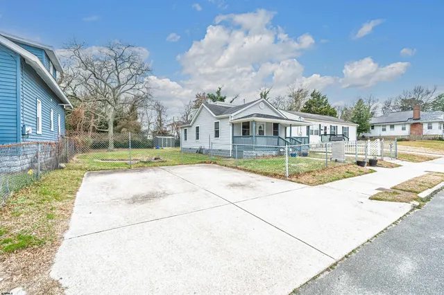 a swimming pool with outdoor seating and yard