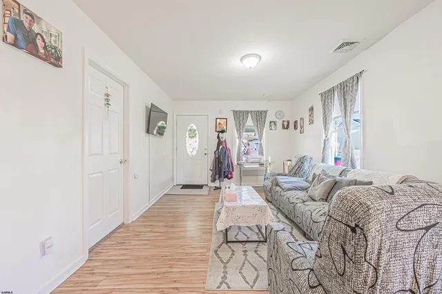 a living room with furniture and a rug