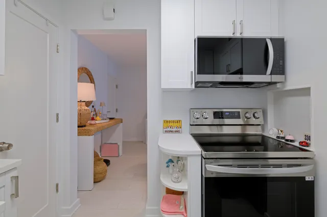 a kitchen with a stove and a microwave