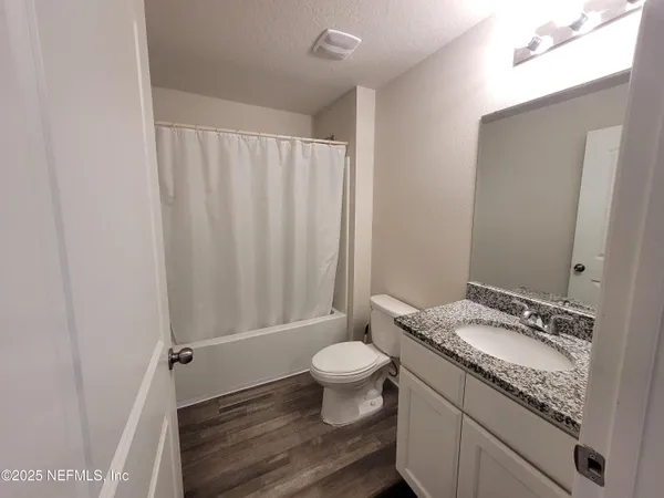 a kitchen with stainless steel appliances granite countertop a sink stove and microwave