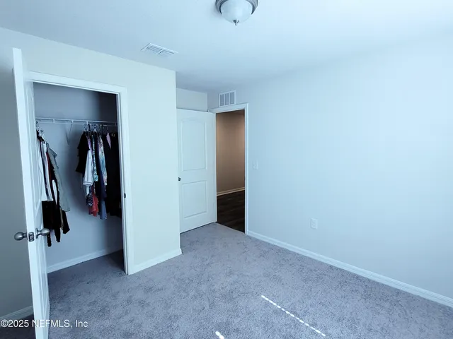 a view of a utility room with closet