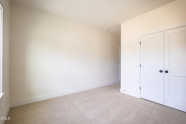 a kitchen with stainless steel appliances granite countertop a stove a sink and a wooden floor