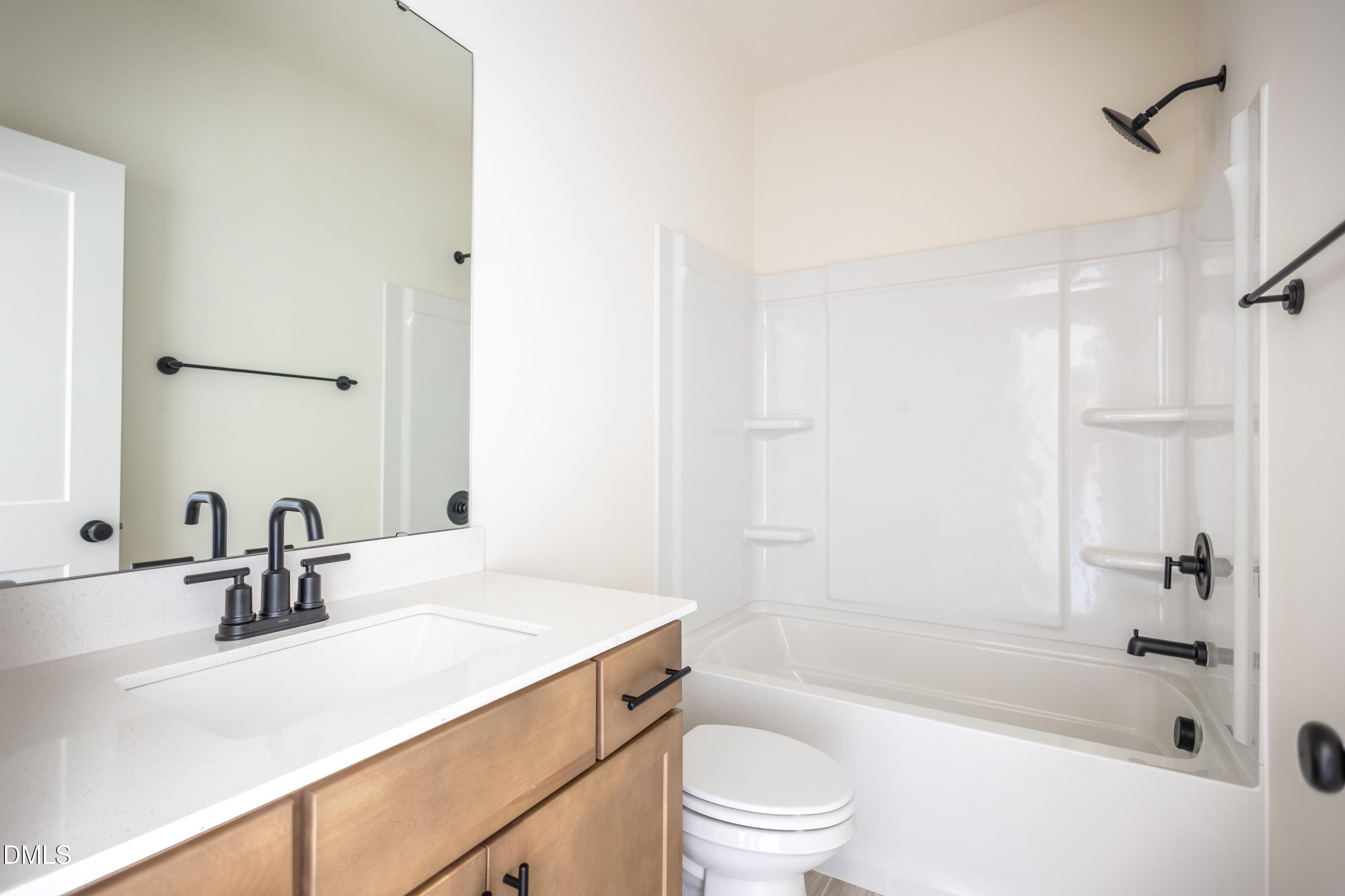 2001 Skipping Stone Drive Durham, NC 27705 - Photo 12 of 44 a bathroom with a sink a toilet and shower