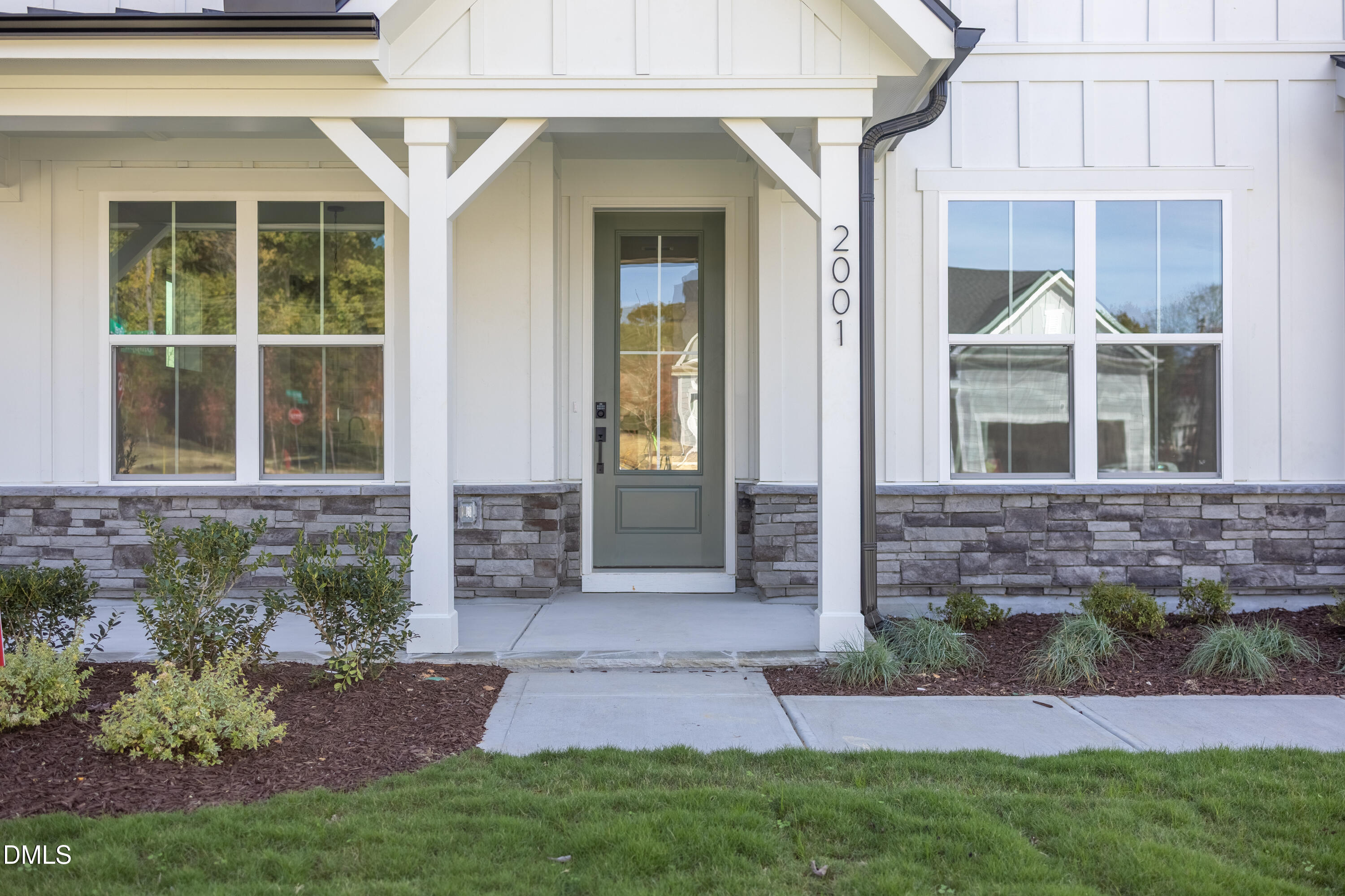 2001 Skipping Stone Drive Durham, NC 27705 - Photo 2 of 44 a front view of a house with a yard