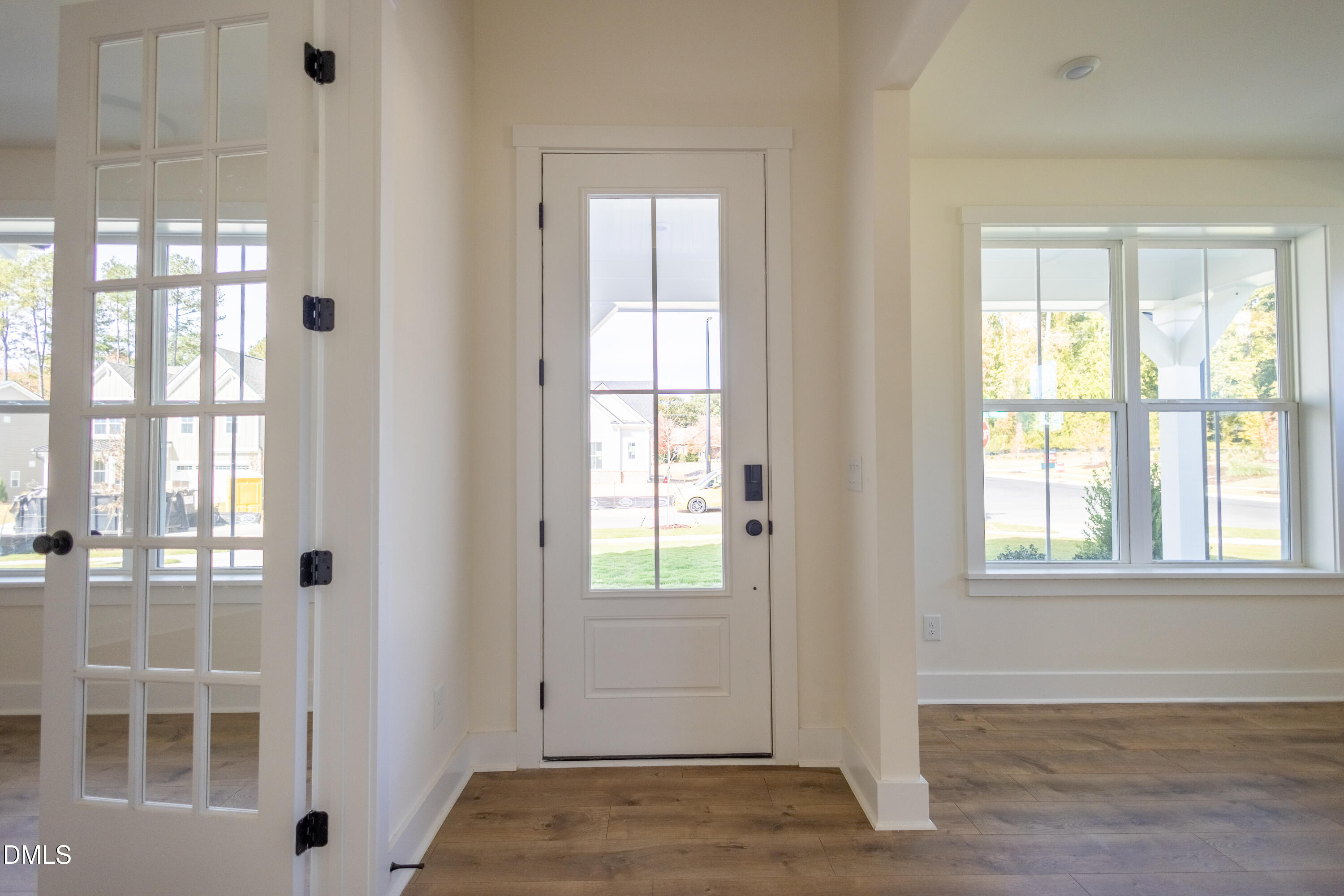 2001 Skipping Stone Drive Durham, NC 27705 - Photo 34 of 44 a view of an empty room with wooden floor and windows