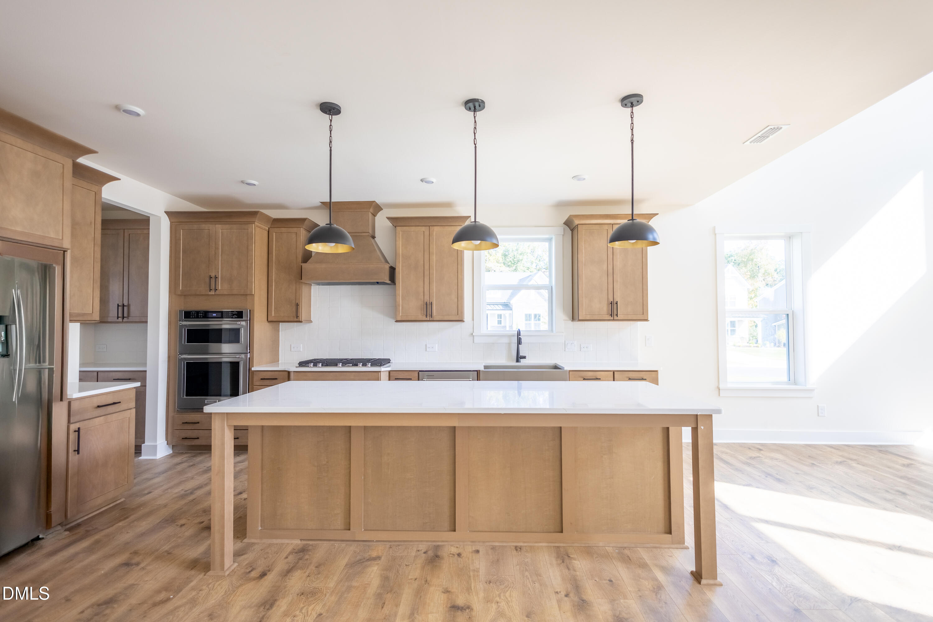 2001 Skipping Stone Drive Durham, NC 27705 - Photo 4 of 44 a kitchen with kitchen island a counter top space a sink stainless steel appliances and cabinets