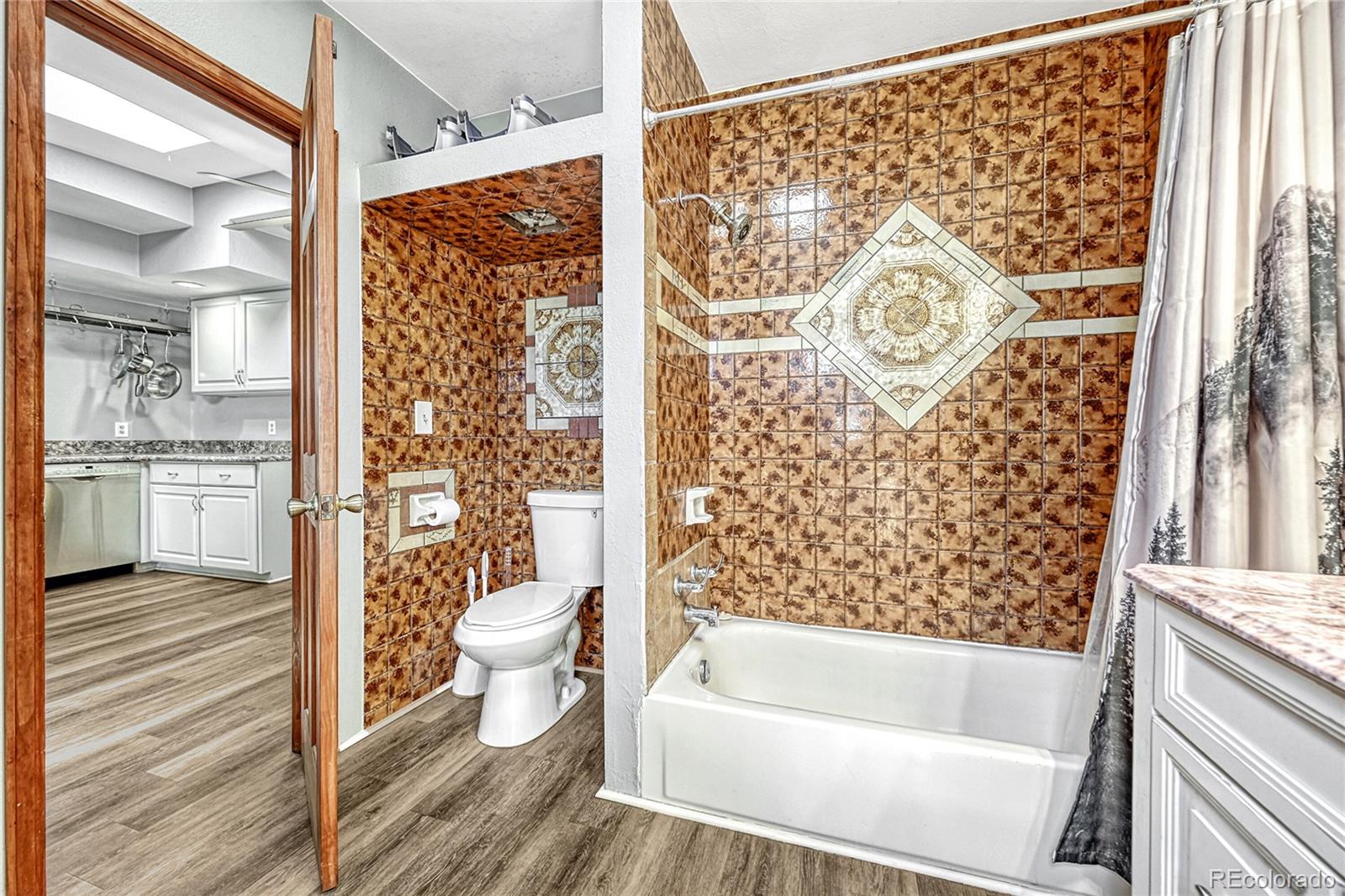 944 Inca Street Denver, CO 80204 - Photo 22 of 29 a bathroom with a toilet and a shower