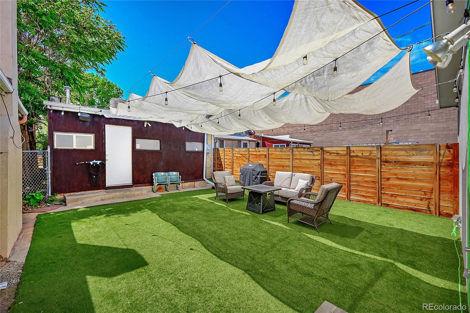 944 Inca Street Denver, CO 80204 - Photo 28 of 29 a view of a house with backyard porch and sitting area