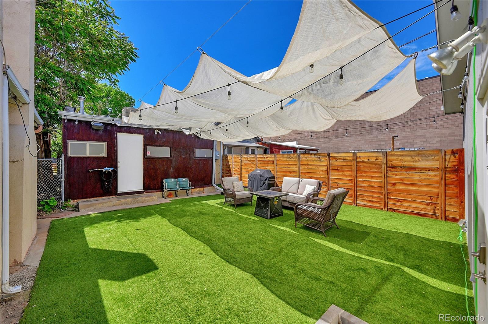 944 Inca Street Denver, CO 80204 - Photo 29 of 29 a view of a house with backyard porch and sitting area