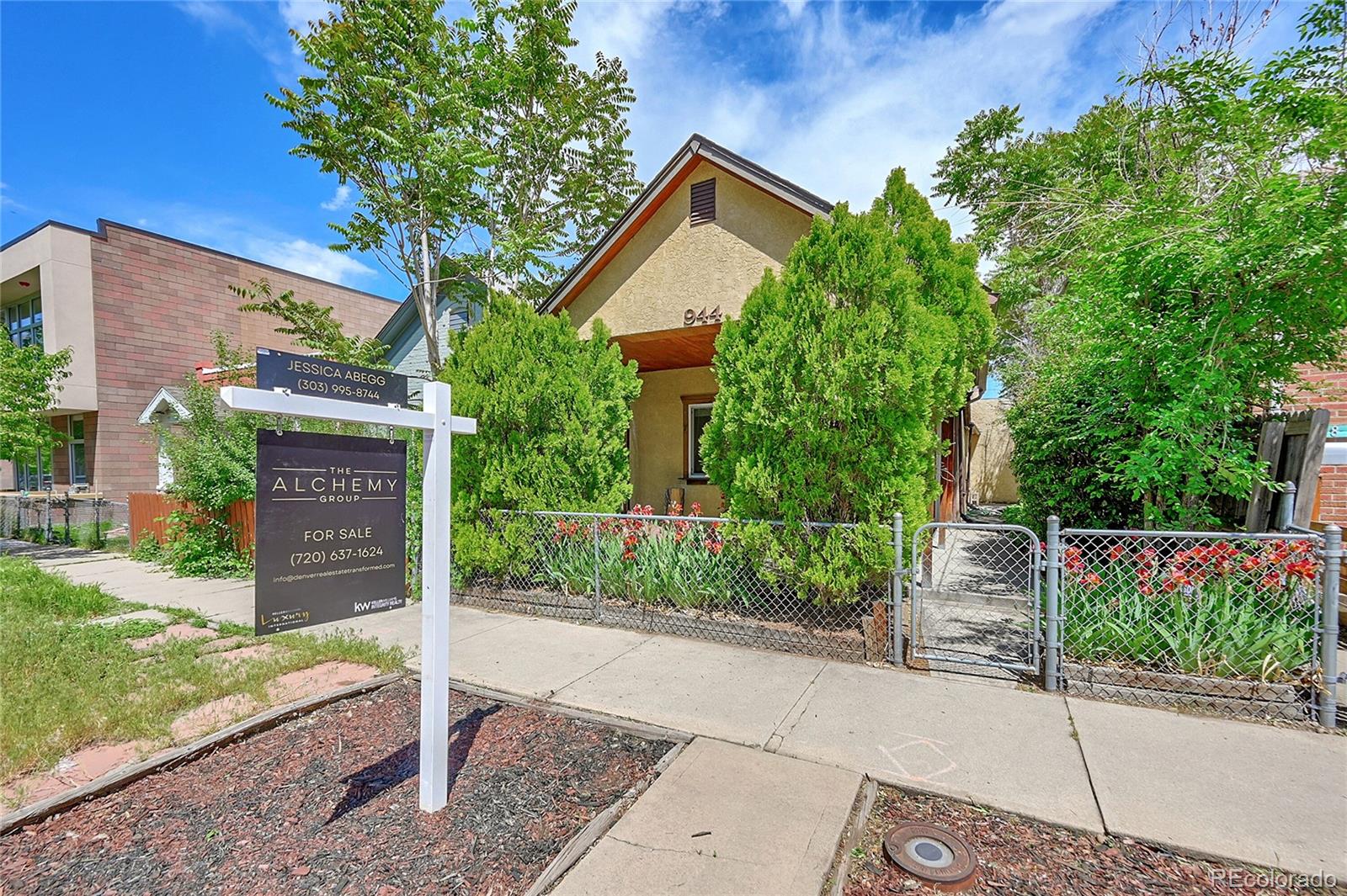 944 Inca Street Denver, CO 80204 - Photo 4 of 29 a front view of a house with a garden